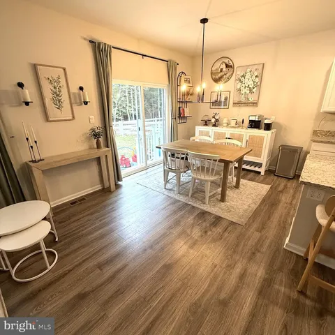 a kitchen with a sink appliances and cabinets