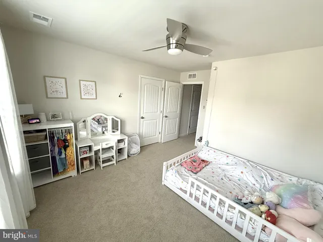 a bathroom with a double vanity sink and mirror