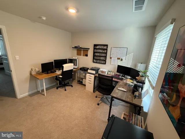 a bedroom with a bed and flat screen tv
