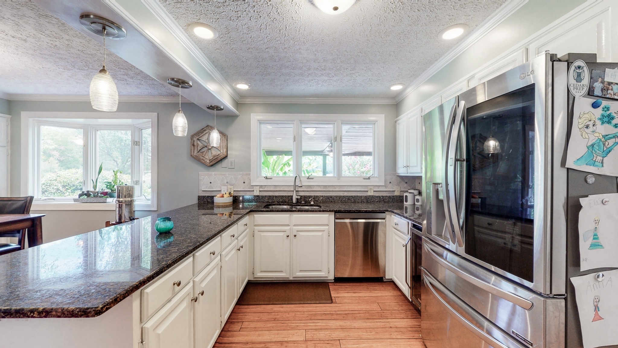 207 Bethlehem Road Lebanon, TN 37087 - Photo 11 of 35 a kitchen with stainless steel appliances granite countertop a sink and stove