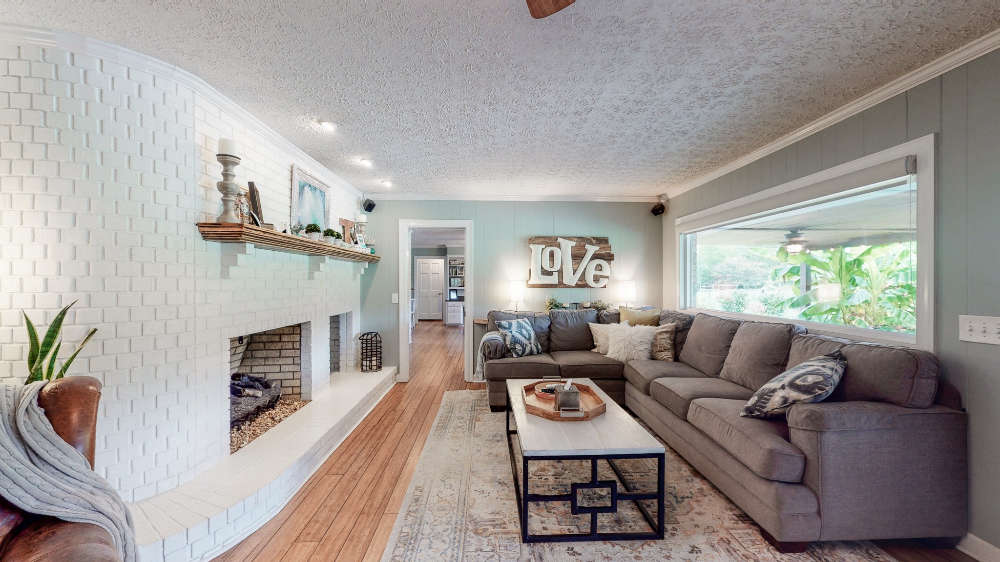 207 Bethlehem Road Lebanon, TN 37087 - Photo 13 of 35 a living room with furniture a fireplace and a window