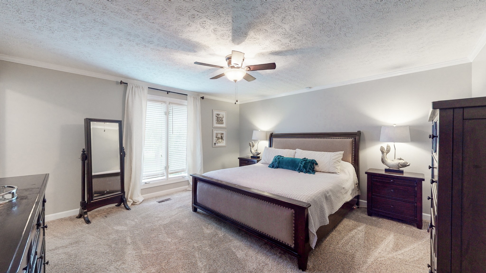 207 Bethlehem Road Lebanon, TN 37087 - Photo 15 of 35 a bedroom with a bed and a chandelier