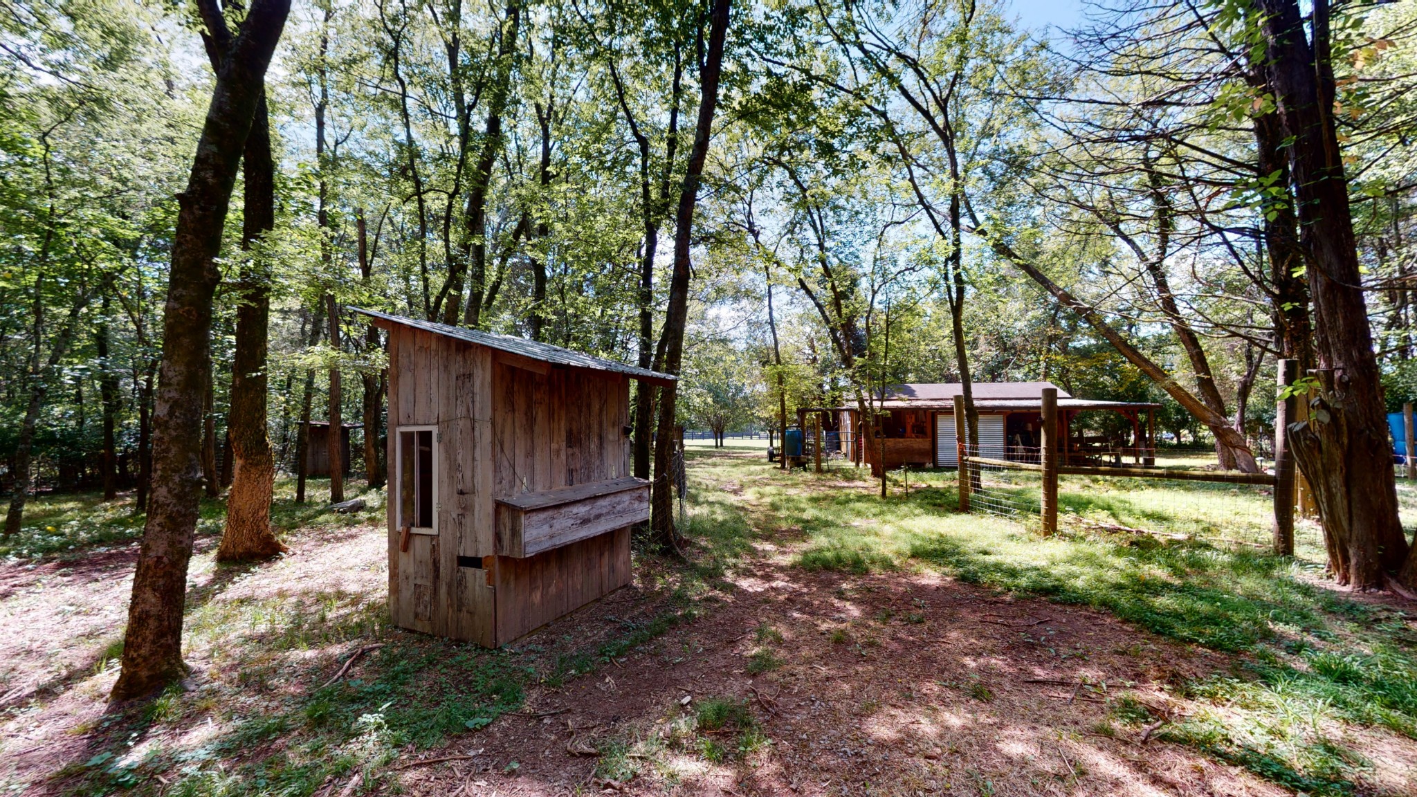 207 Bethlehem Road Lebanon, TN 37087 - Photo 32 of 35 a view of a backyard with large trees and wooden fence