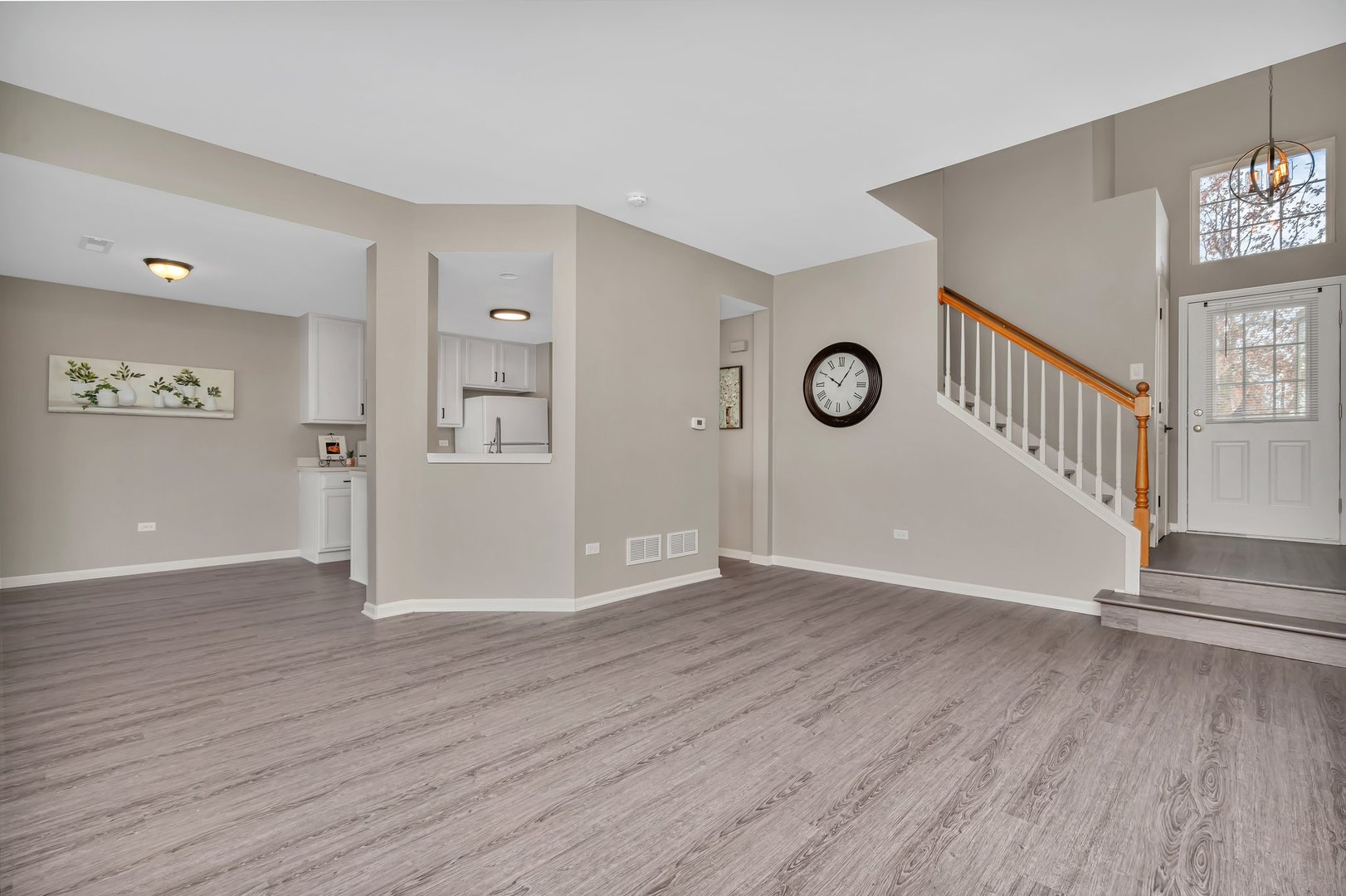 15340 Pinewood Road Lockport, IL 60441 - Photo 3 of 31 an empty room with wooden floor and windows