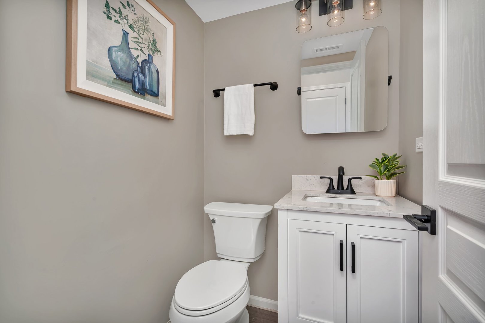 15340 Pinewood Road Lockport, IL 60441 - Photo 10 of 31 a bathroom with a toilet sink and mirror
