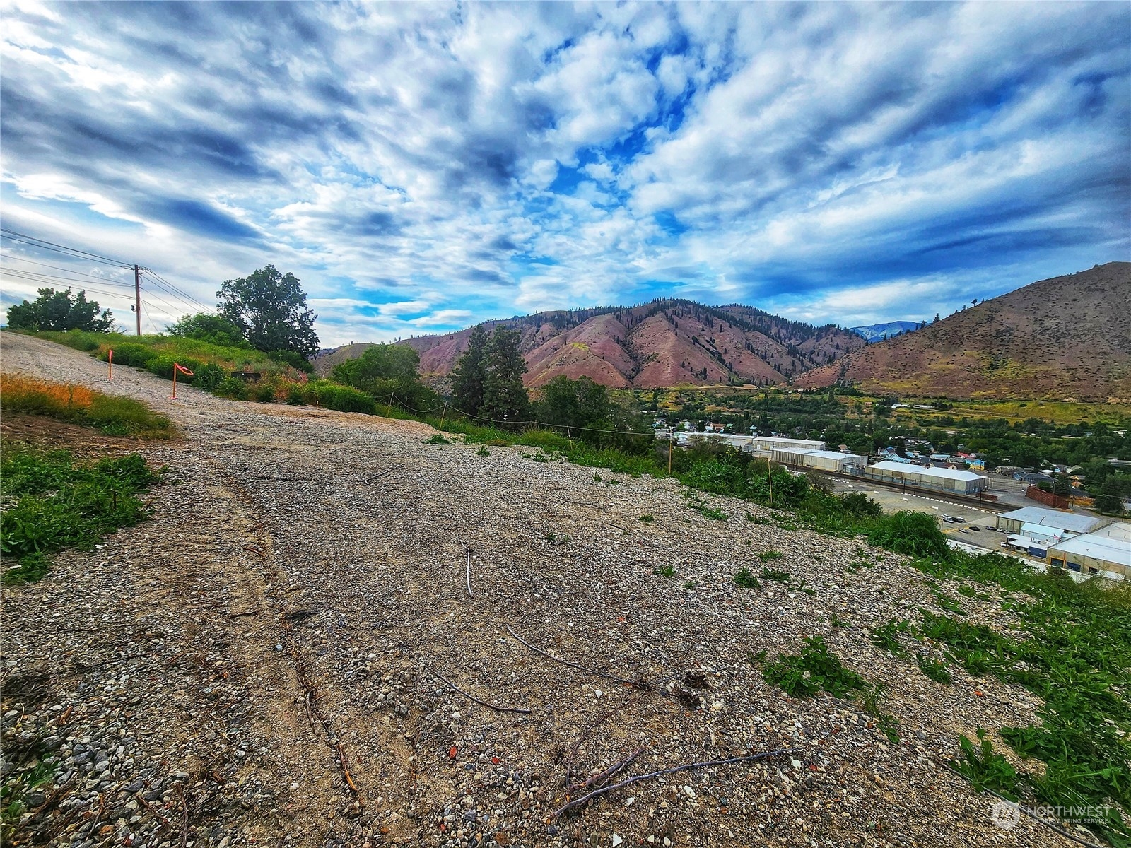 309 Kennedy Road Cashmere, WA 98815 - Photo 6 of 7 a view of a lake with mountains in the background
