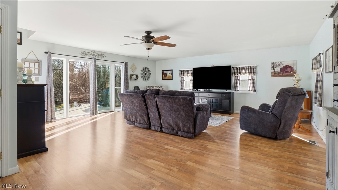 65892 Endley Road Cambridge, OH 43725 - Photo 15 of 50 Living area featuring a ceiling fan and light wood-type flooring