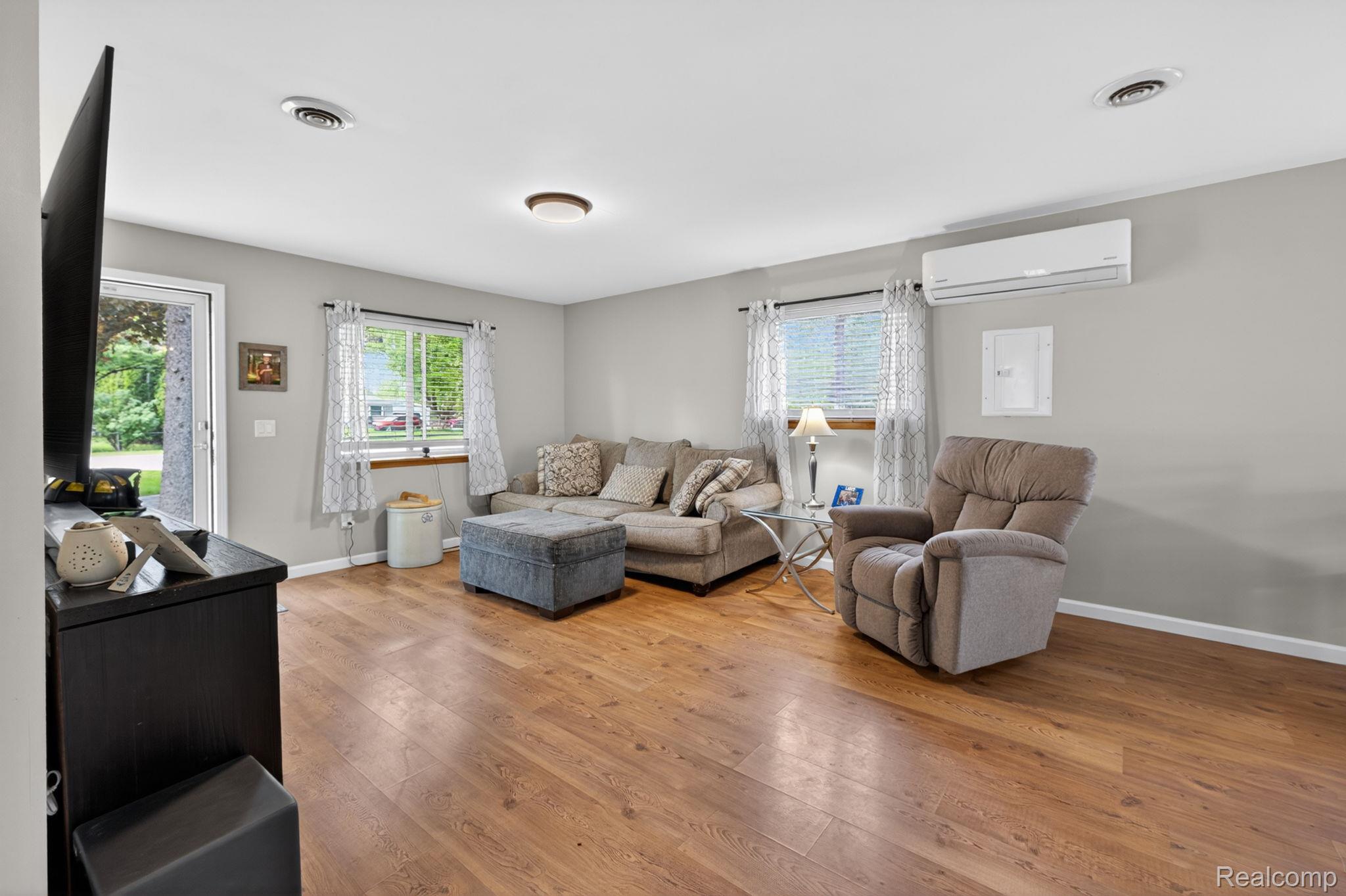 6354 Lapeer Road Burton, MI 48509 - Photo 15 of 44 Living area featuring light wood finished floors and healthy amount of natural light
