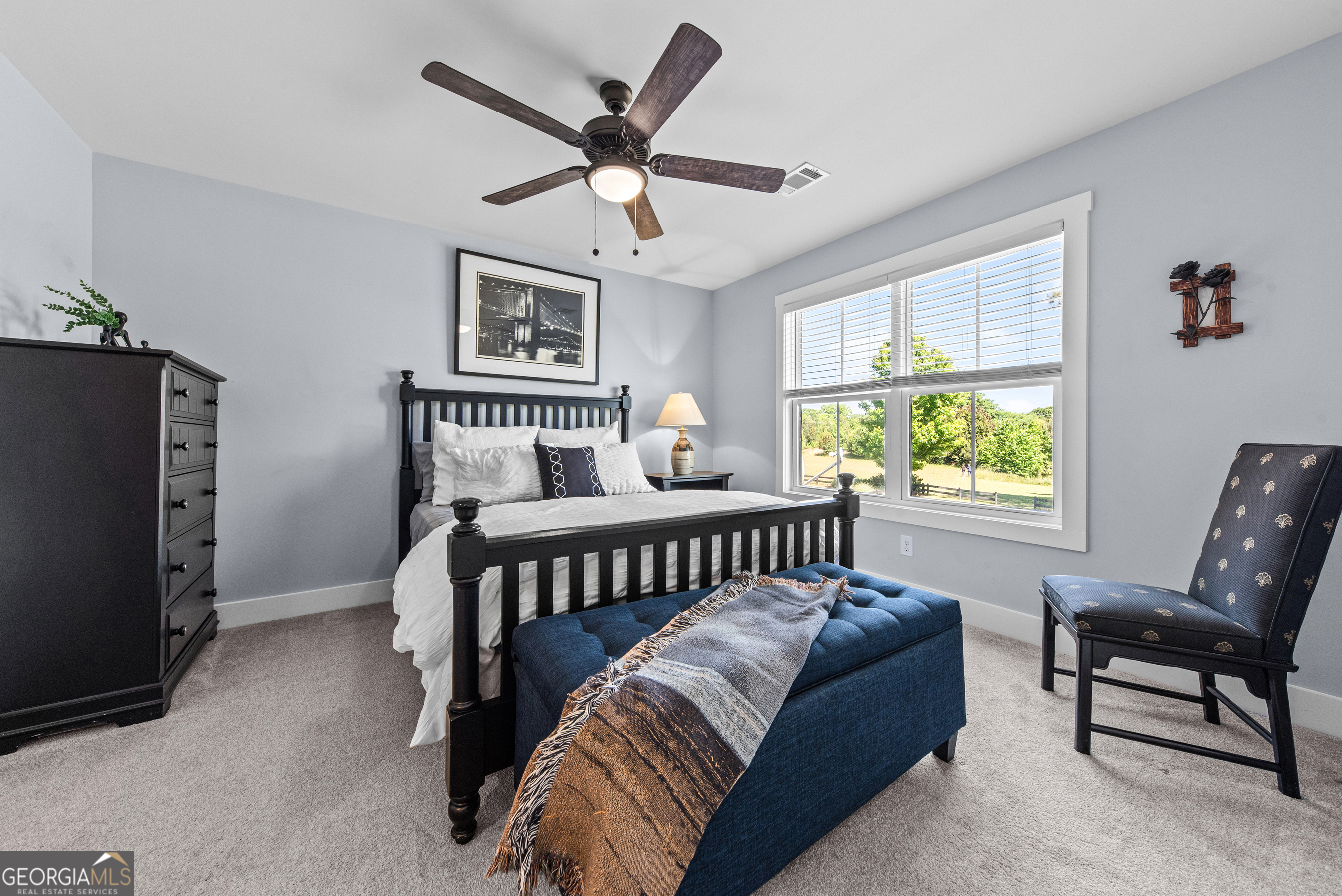 1100 West Magnolia Loop Madison, GA 30650 - Photo 24 of 40 a bedroom with furniture and windows