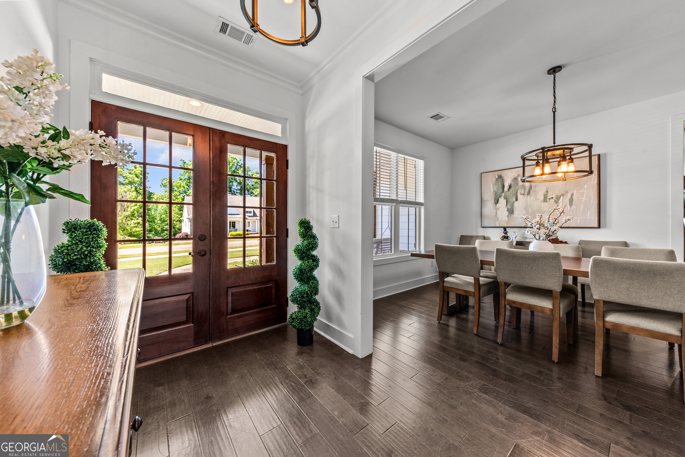 1100 West Magnolia Loop Madison, GA 30650 - Photo 5 of 40 a view of a dining room with furniture window and wooden floor