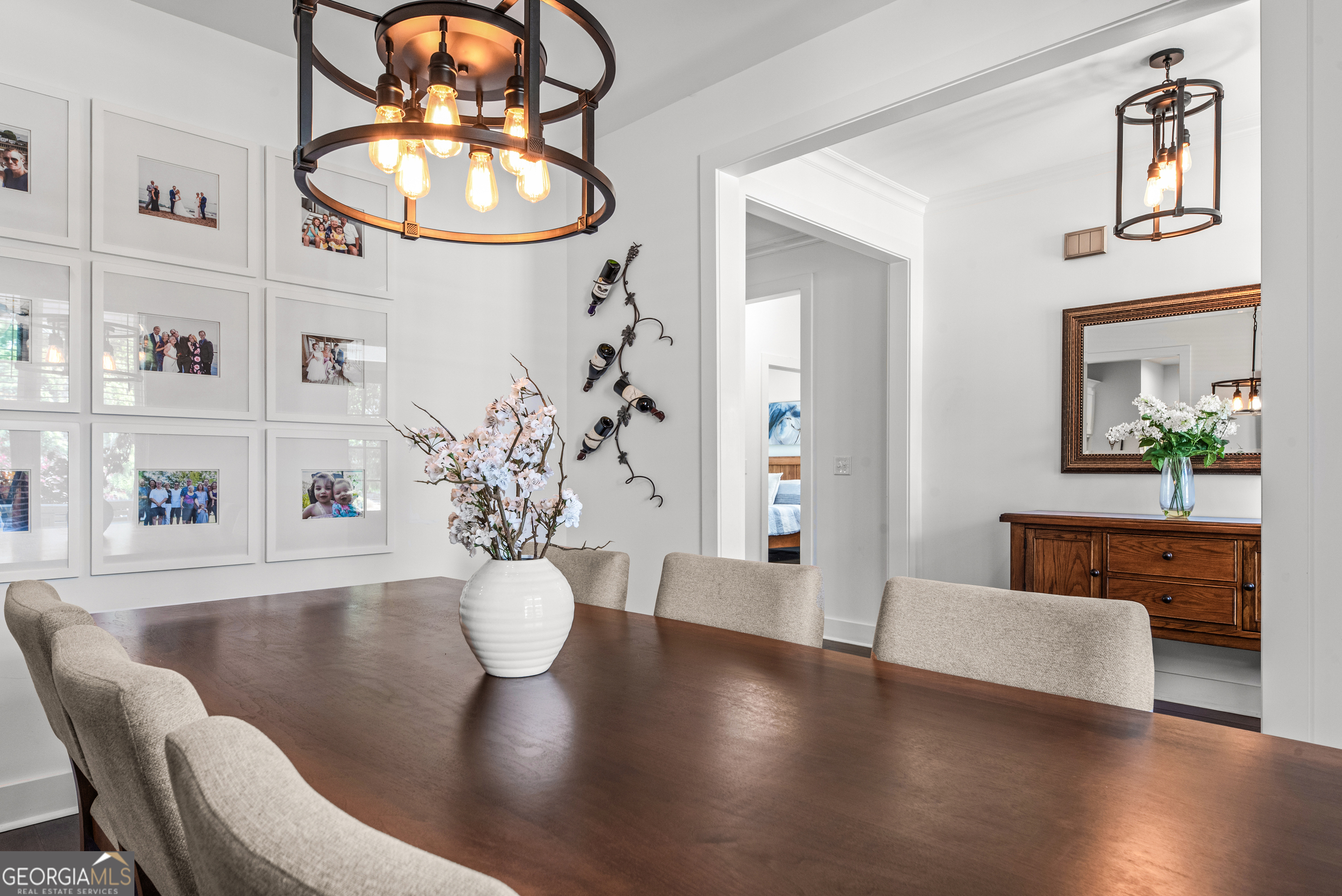 1100 West Magnolia Loop Madison, GA 30650 - Photo 7 of 40 a view of a dining room with furniture a chandelier and wooden floor