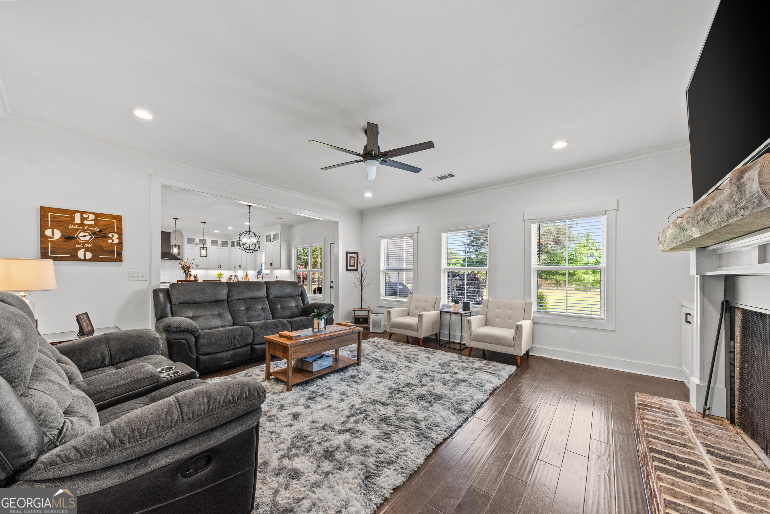 1100 West Magnolia Loop Madison, GA 30650 - Photo 10 of 40 a living room with furniture and a wooden floor