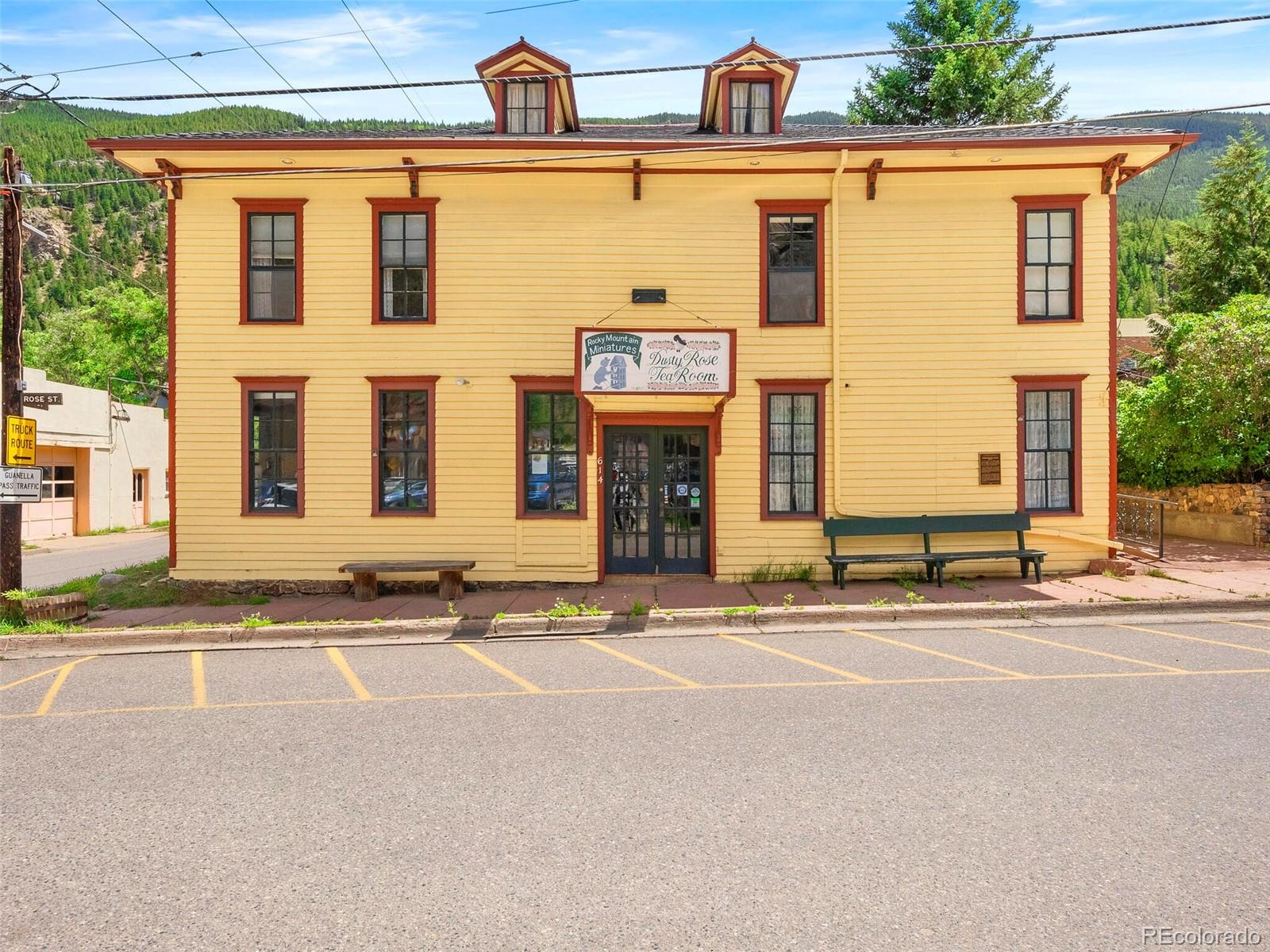 a front view of a building with a road