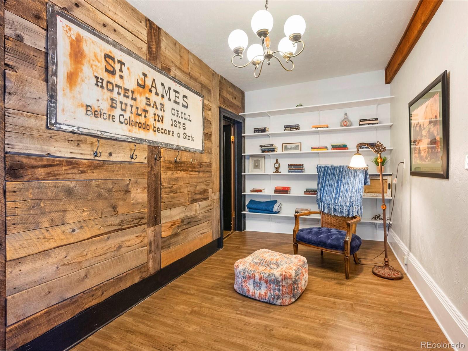 614 Rose Street Georgetown, CO 80444 - Photo 15 of 40 a view of a dining room with furniture and wooden floor