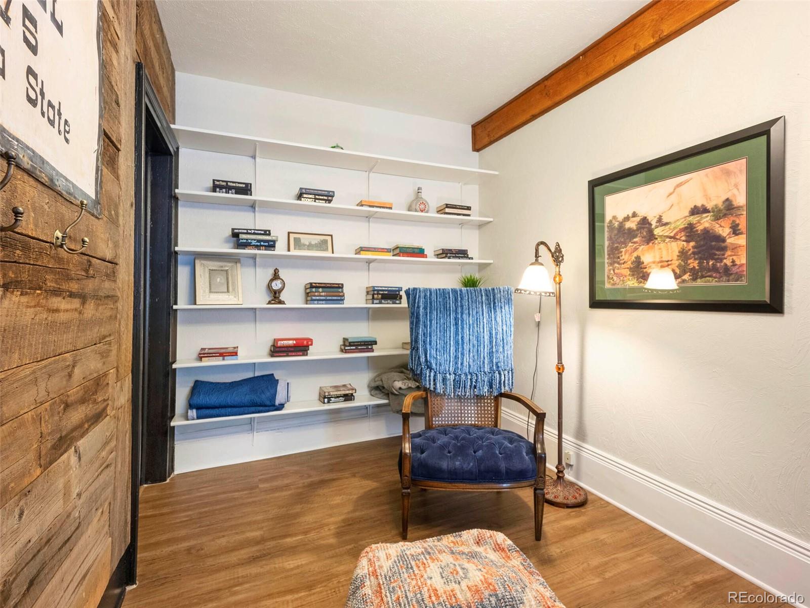 614 Rose Street Georgetown, CO 80444 - Photo 16 of 40 a living room with furniture and a book shelf