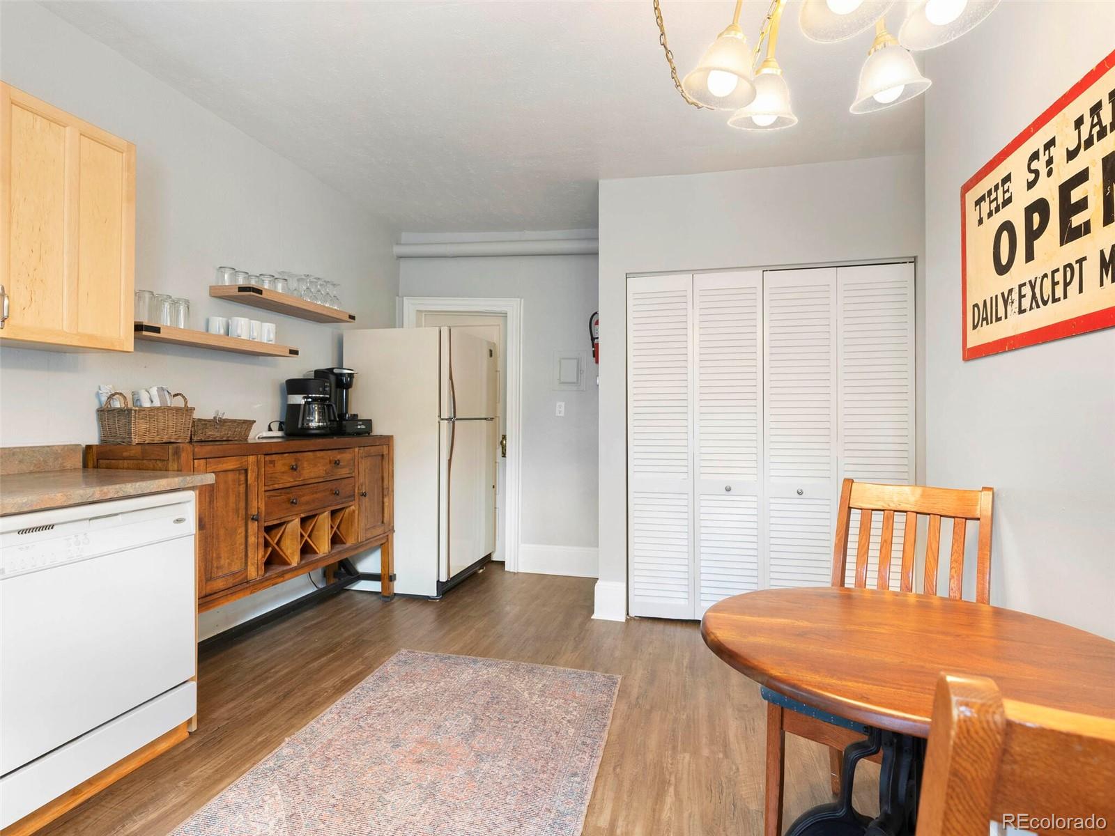 614 Rose Street Georgetown, CO 80444 - Photo 20 of 40 a kitchen with stainless steel appliances kitchen island a refrigerator sink and cabinets