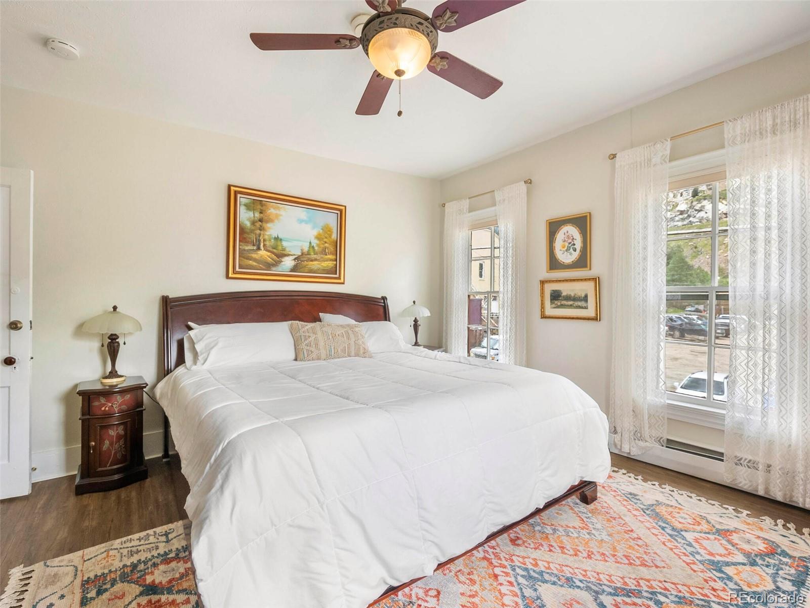 614 Rose Street Georgetown, CO 80444 - Photo 24 of 40 a bedroom with a bed and a painting on the wall