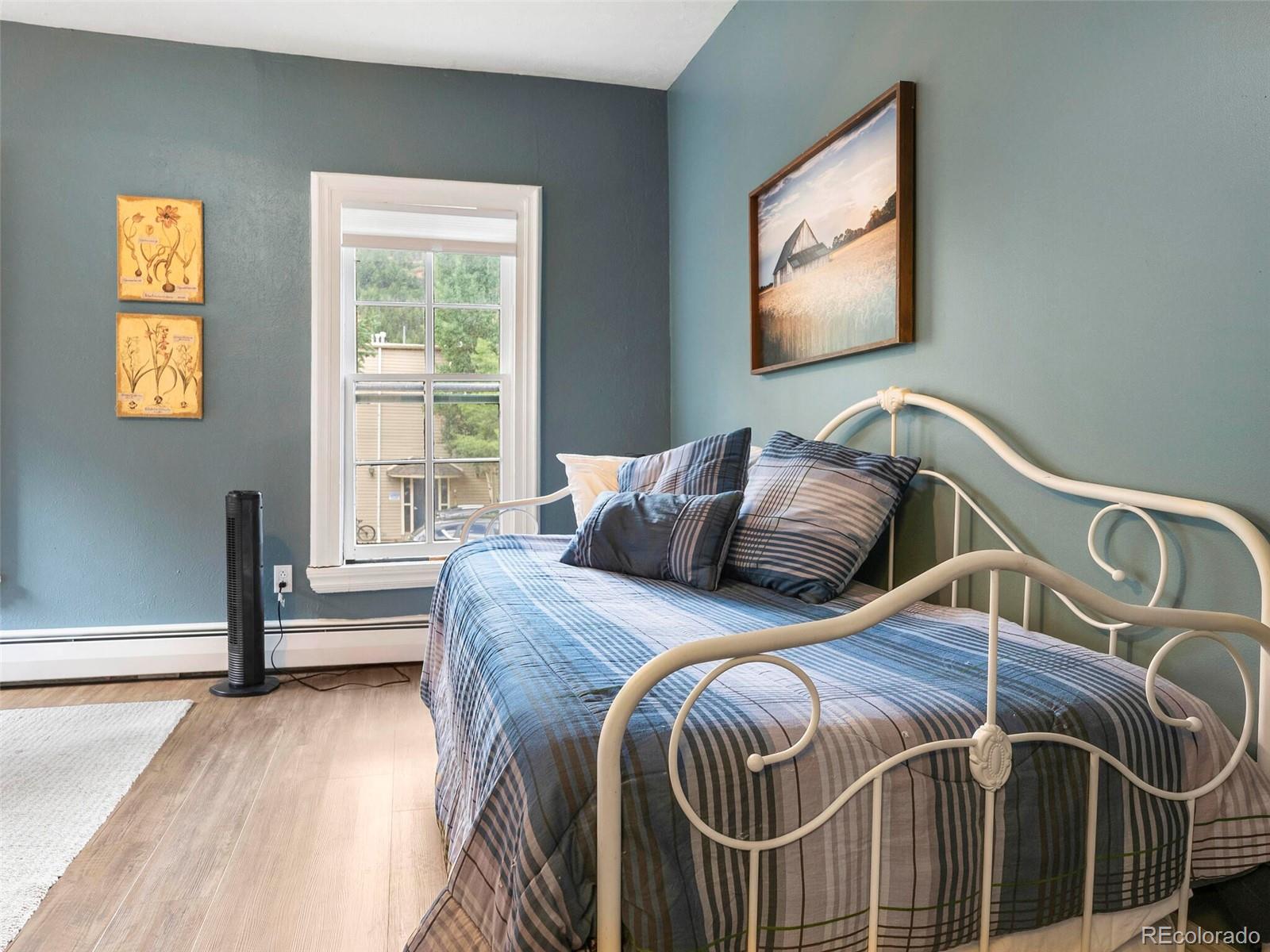 614 Rose Street Georgetown, CO 80444 - Photo 30 of 40 a bed sitting in a bedroom next to a window