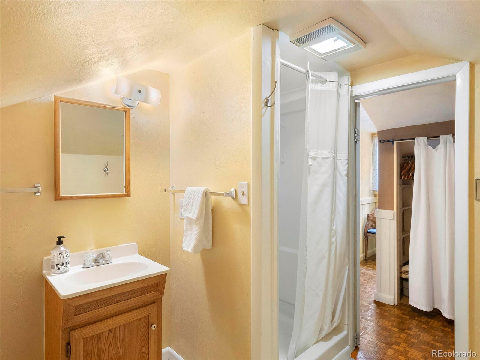 614 Rose Street Georgetown, CO 80444 - Photo 34 of 40 a bathroom with a sink and a mirror