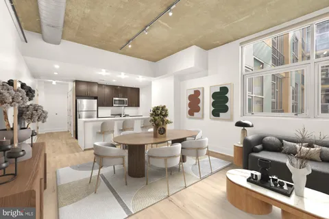 a kitchen with stainless steel appliances kitchen island granite countertop a sink and cabinets