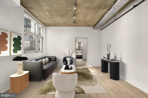 a living room with furniture and window