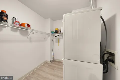 a view of a storage & utility room with a washer dryer