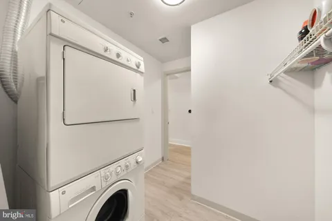 a view of hallway with washer and dryer