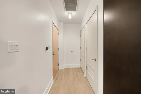 a view of a hallway with a white walls