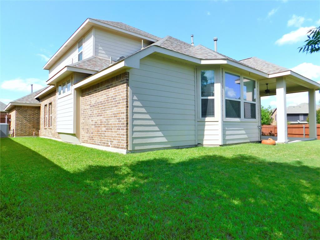 7712 Sweetgate Lane Denton, TX 76208 - Photo 38 of 40 a view of a house with a backyard