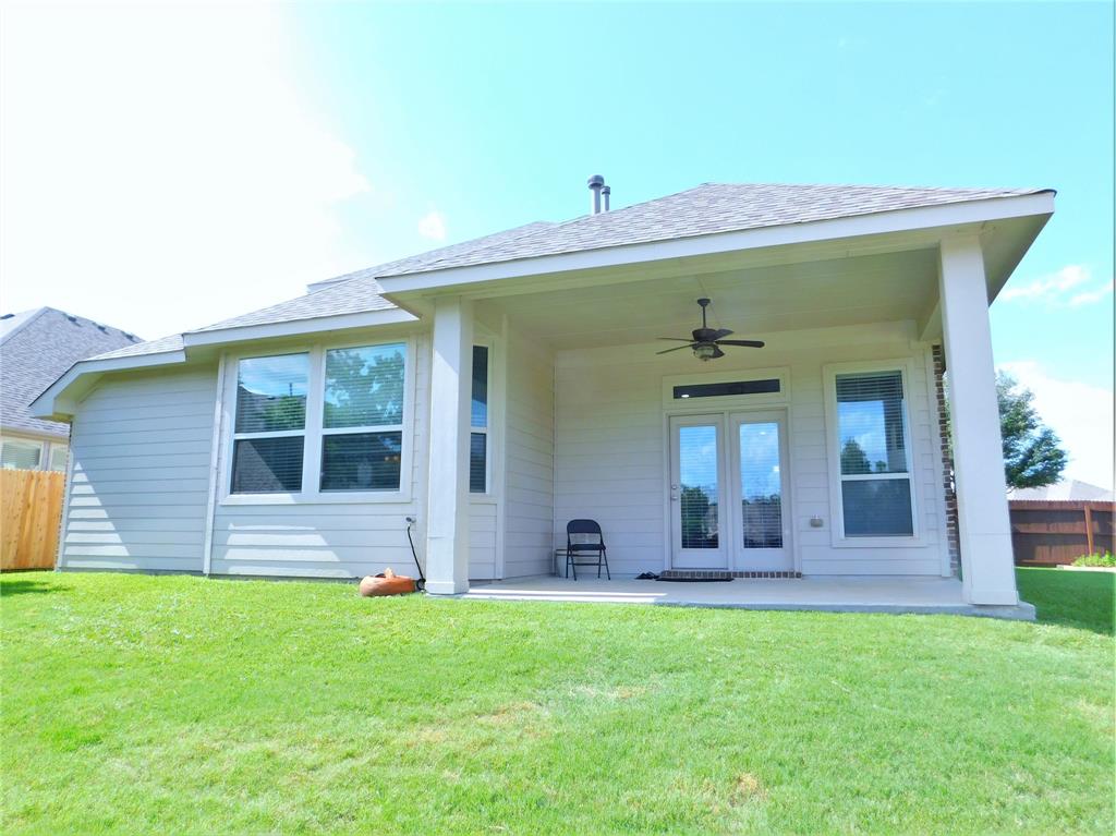 7712 Sweetgate Lane Denton, TX 76208 - Photo 39 of 40 a front view of a house with a yard