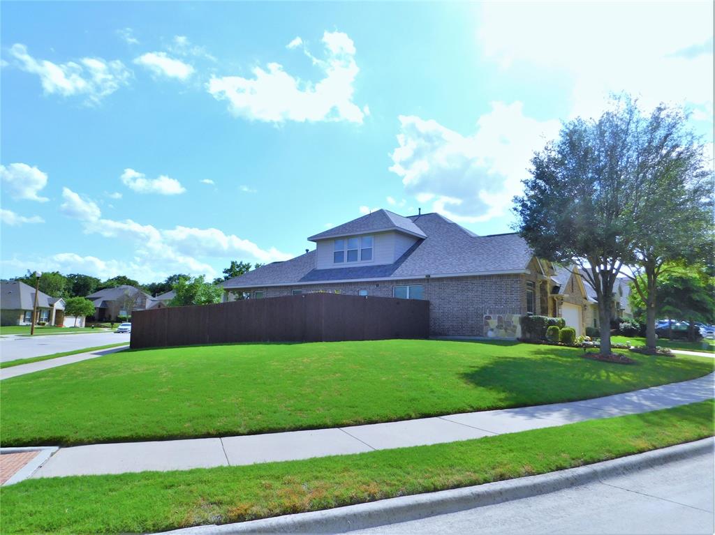 7712 Sweetgate Lane Denton, TX 76208 - Photo 40 of 40 a view of a backyard with a garden