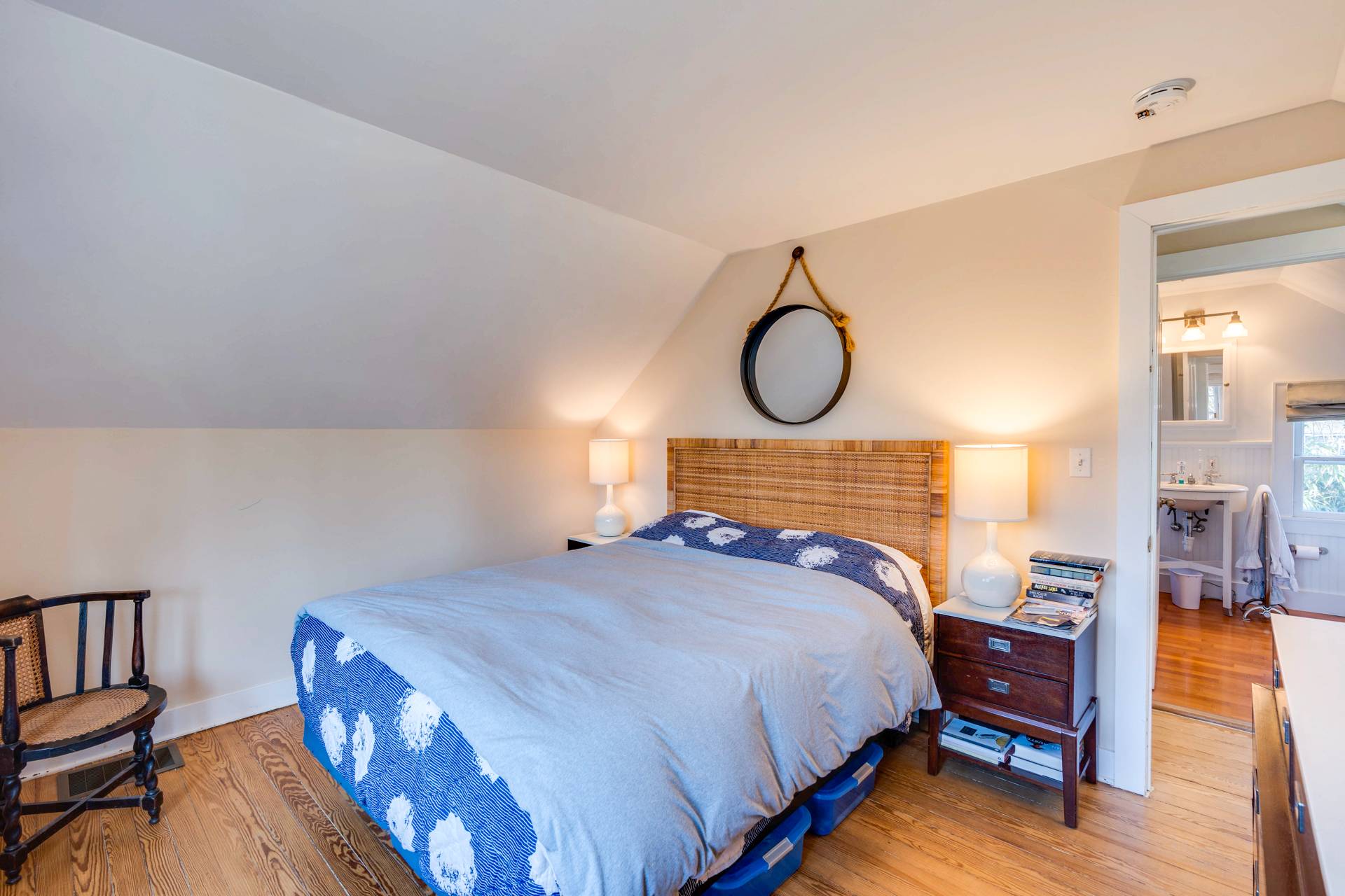 44 Jefferson Street Sag Harbor, NY 11963 - Photo 15 of 18 a bedroom with a bed and wooden floor