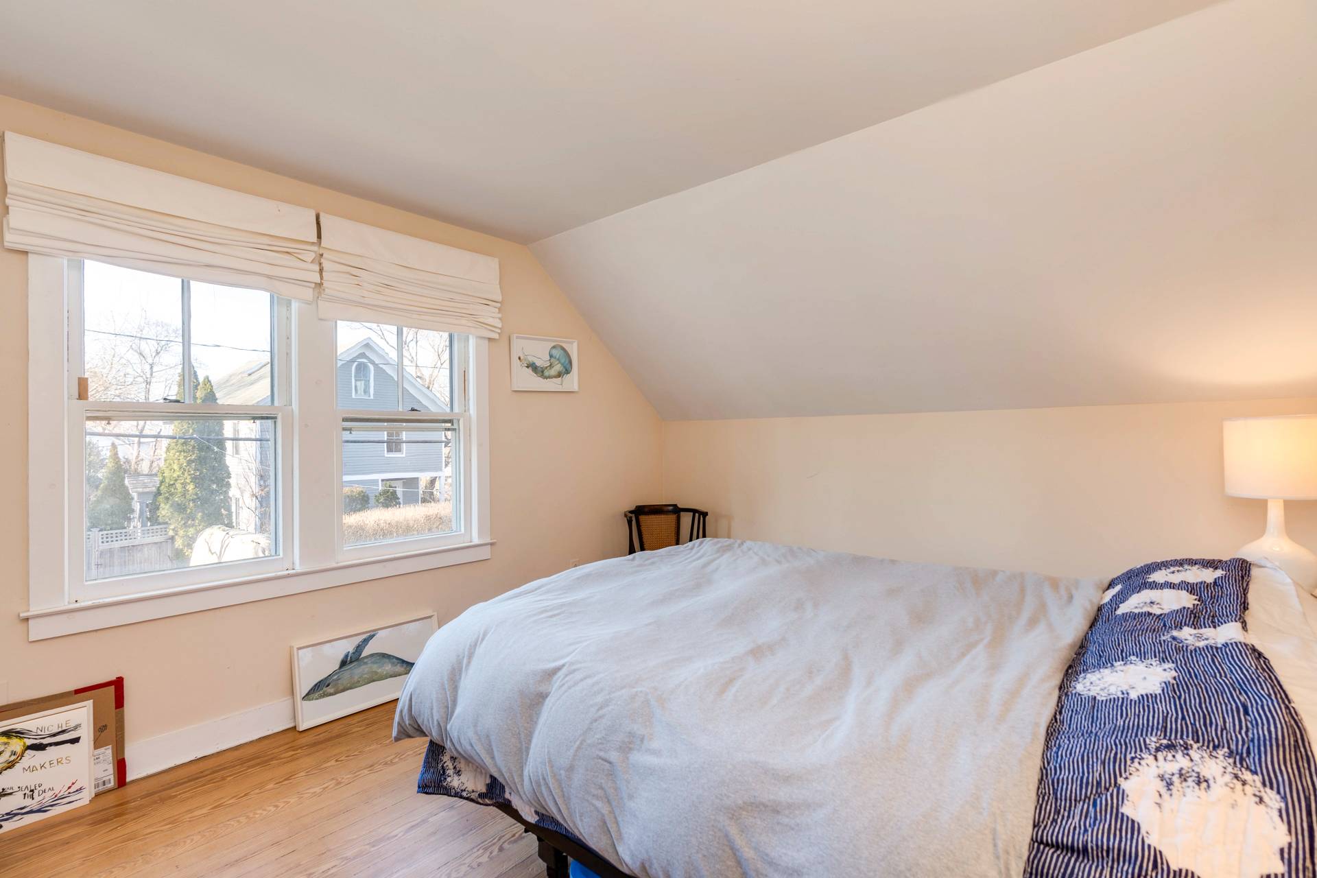 44 Jefferson Street Sag Harbor, NY 11963 - Photo 16 of 18 a bedroom with a bed and a window