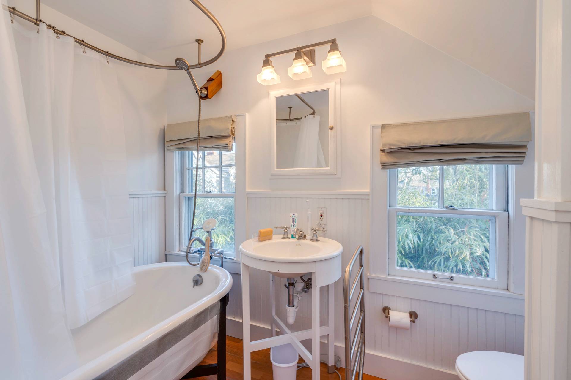 44 Jefferson Street Sag Harbor, NY 11963 - Photo 17 of 18 a bathroom with a sink a toilet and a bathtub