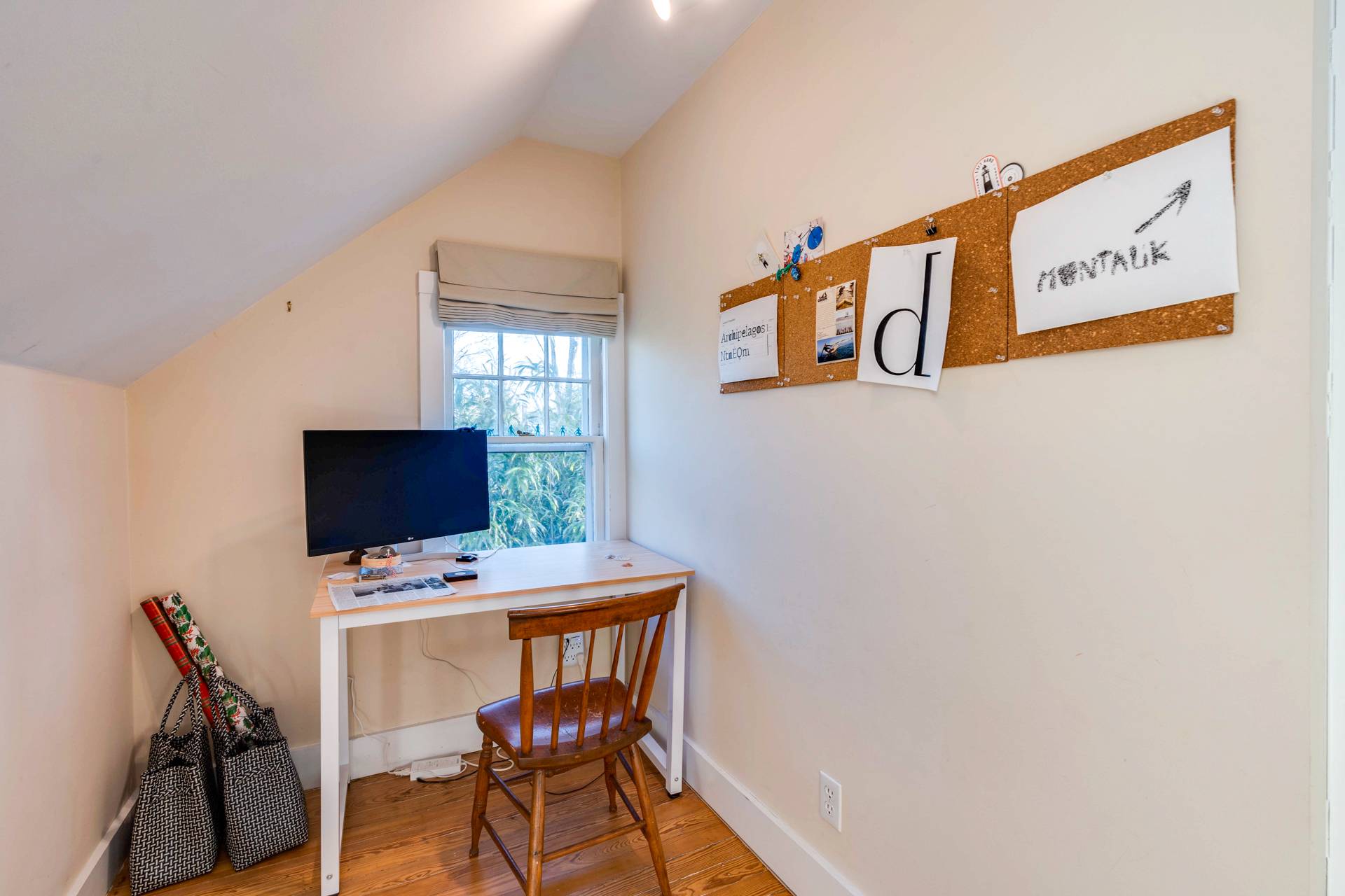 44 Jefferson Street Sag Harbor, NY 11963 - Photo 18 of 18 a workspace with furniture and wooden floor