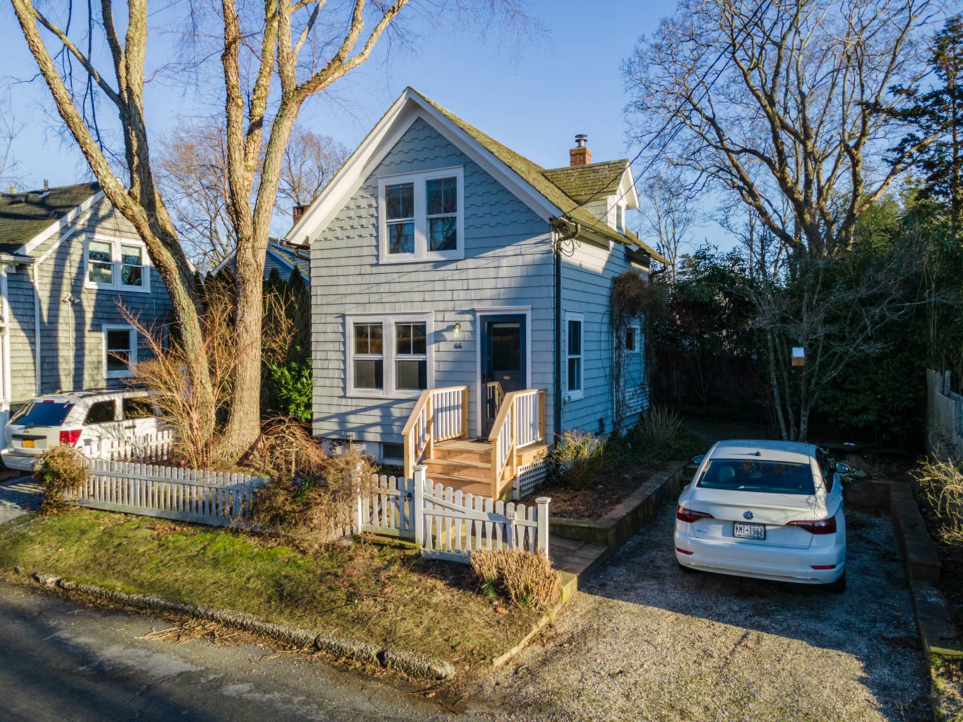 44 Jefferson Street Sag Harbor, NY 11963 - Photo 6 of 18 a front view of a house with cars parked