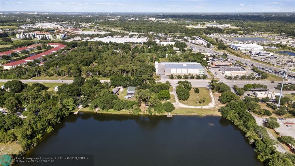 2511 South Jenkins Road Fort Pierce, FL 34947 - Photo 4 of 4 an aerial view of residential houses with outdoor space and trees