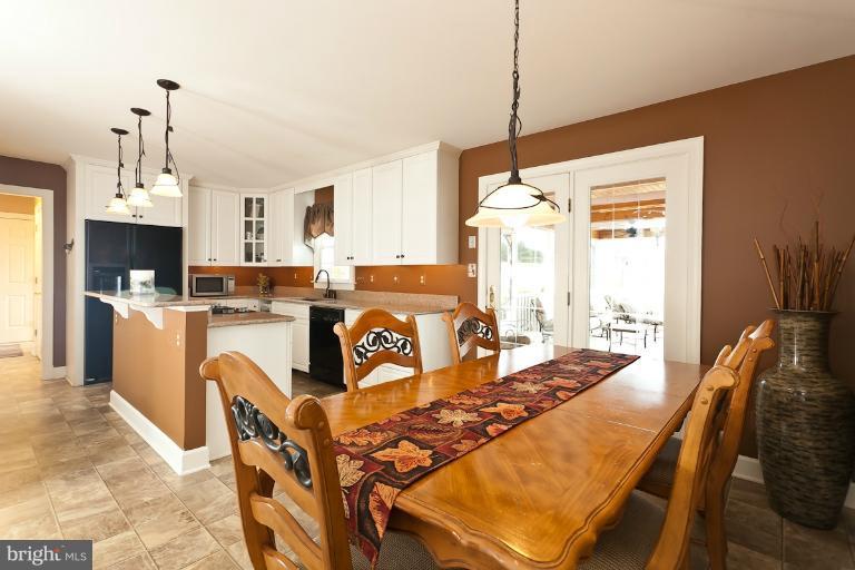 1431 Trappe Road Street, MD 21154 - Photo 14 of 30 Kitchen with Eat In Area that leads to Sun Porch