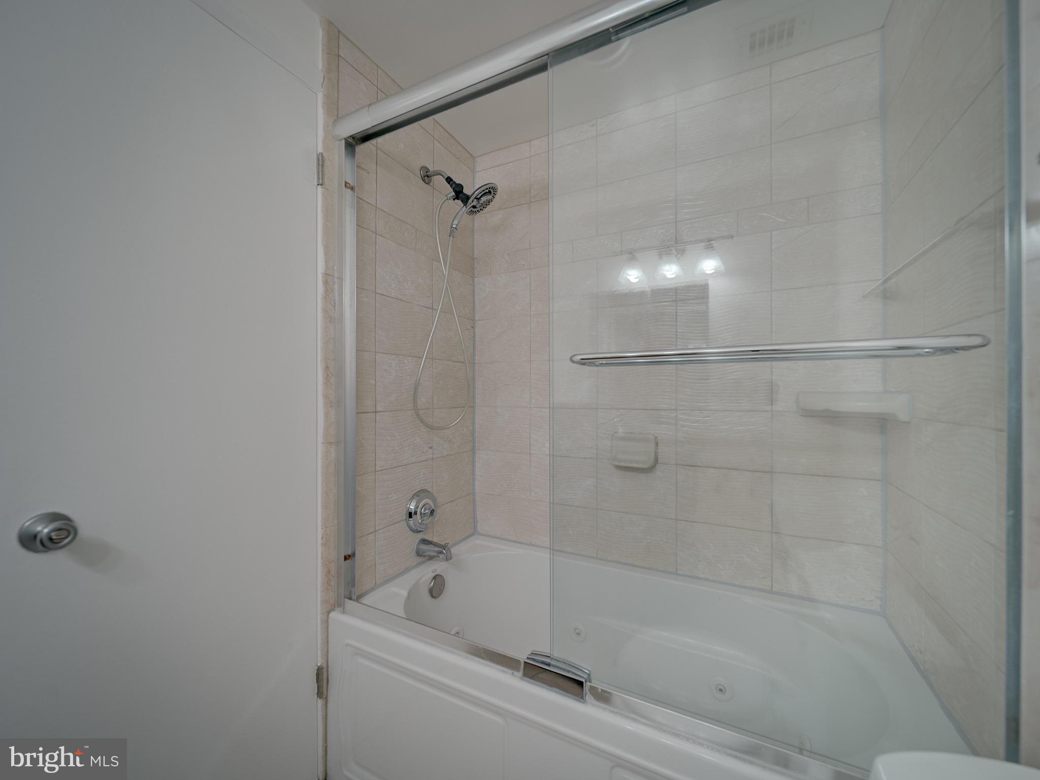 12001 Old Columbia Pike, Unit 514 Silver Spring, MD 20904 - Photo 6 of 41 a bathroom with a bathtub