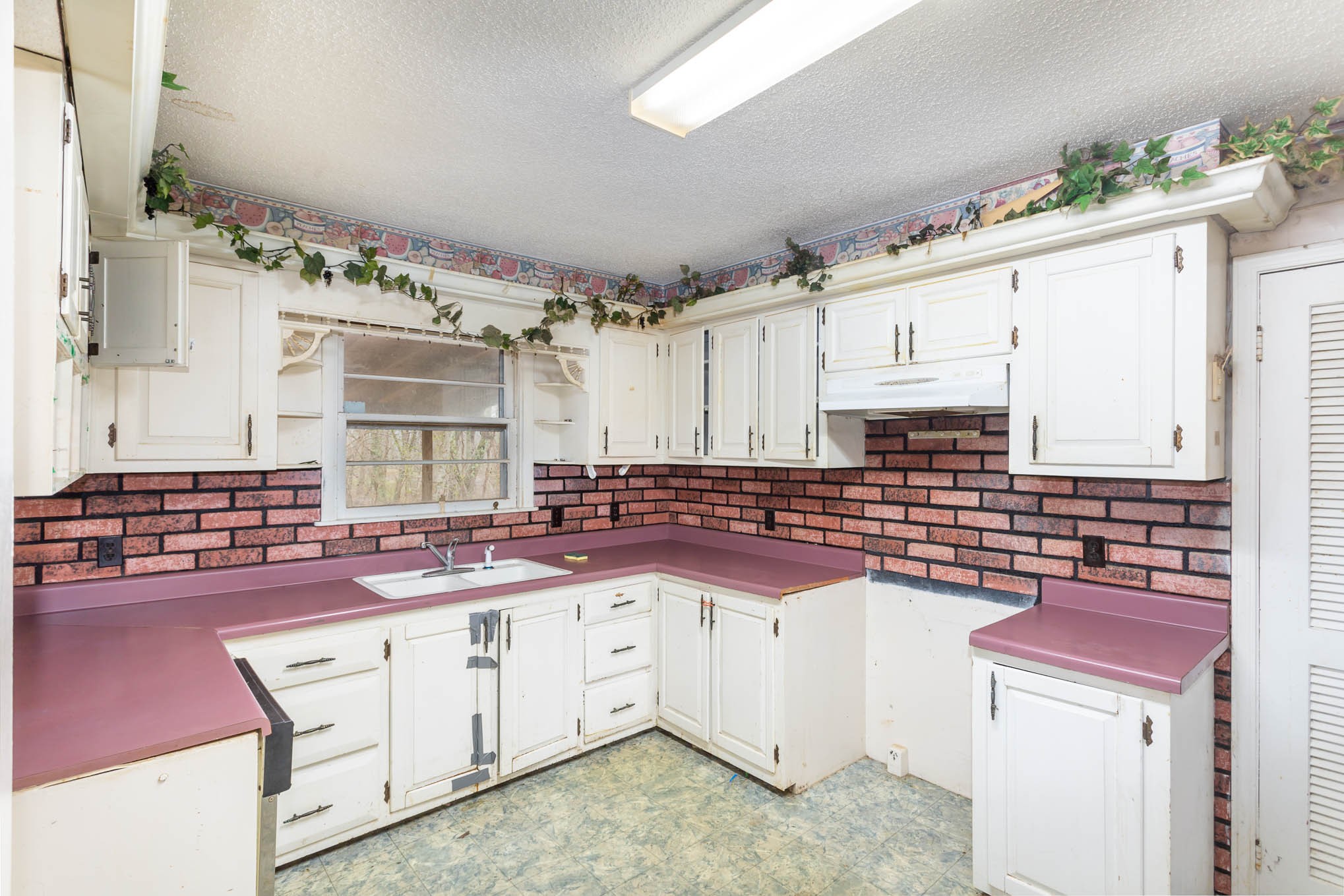 5631 Wesley Ridge Road Lyles, TN 37098 - Photo 9 of 19 a kitchen with cabinets and window