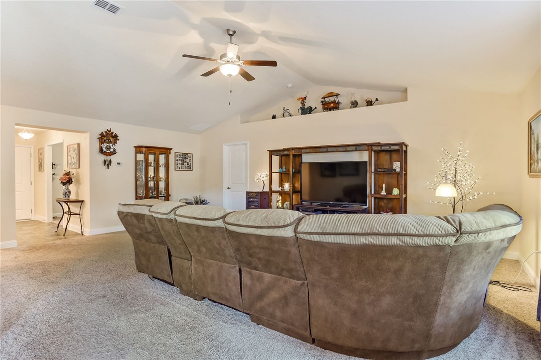 88156 Maybourne Road Yulee, FL 32097 - Photo 15 of 35 a living room with furniture and a fireplace