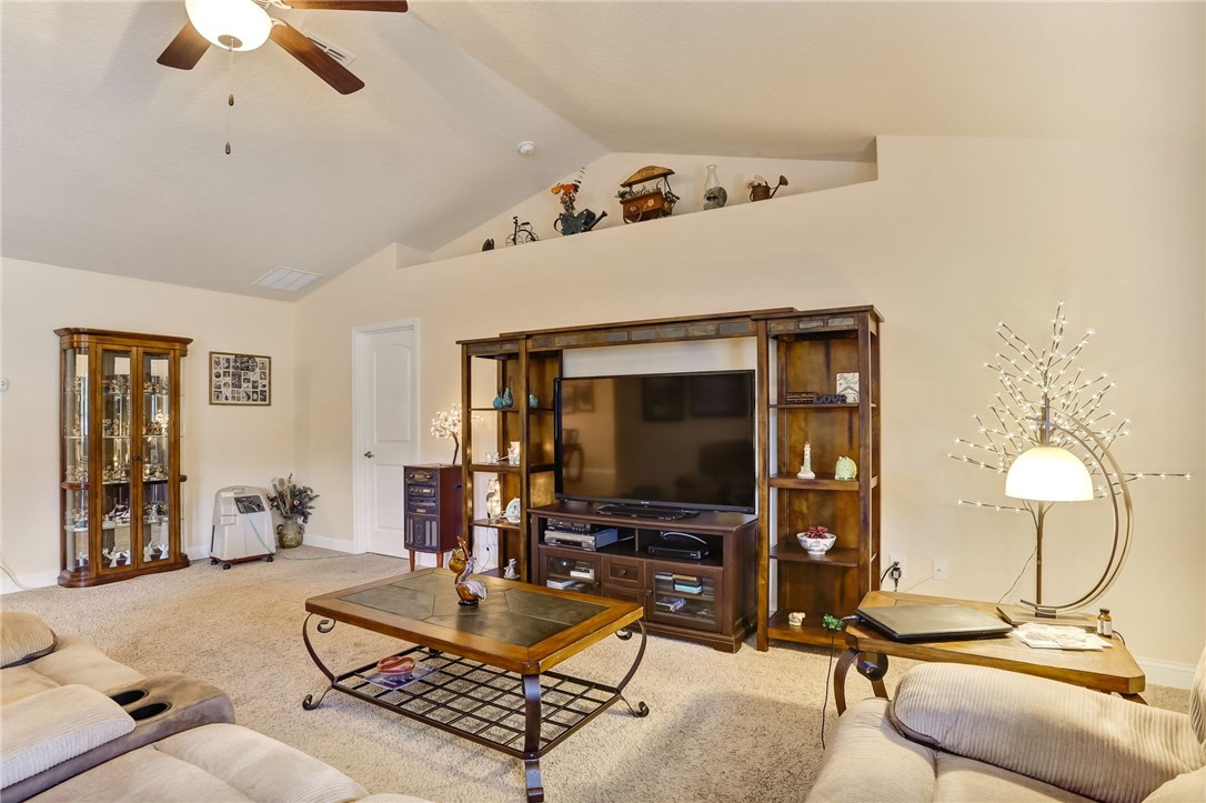 88156 Maybourne Road Yulee, FL 32097 - Photo 16 of 35 a living room with furniture and a flat screen tv