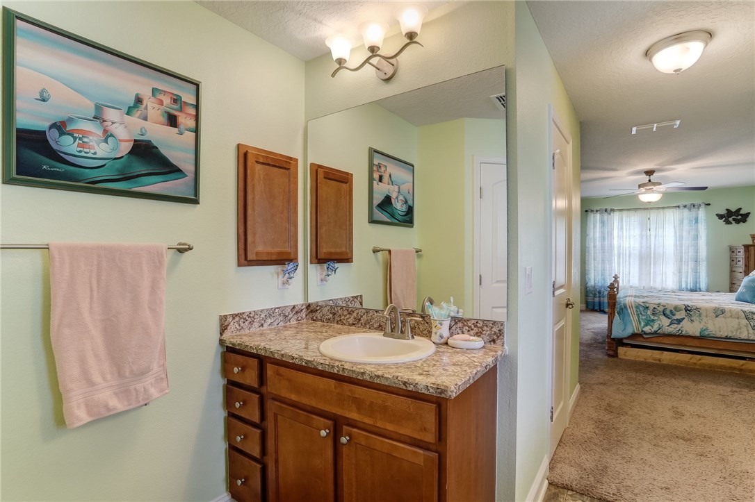 88156 Maybourne Road Yulee, FL 32097 - Photo 23 of 35 a en suite bathroom with a sink double vanity and a mirror