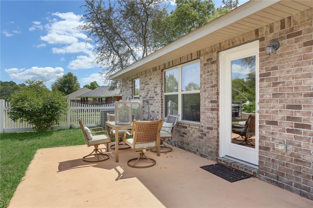 88156 Maybourne Road Yulee, FL 32097 - Photo 33 of 35 a view of backyard with outdoor seating and green space