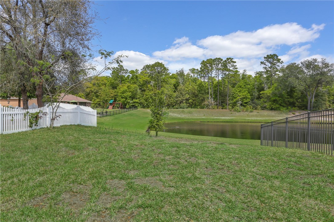 88156 Maybourne Road Yulee, FL 32097 - Photo 35 of 35 a view of a lake with a big yard