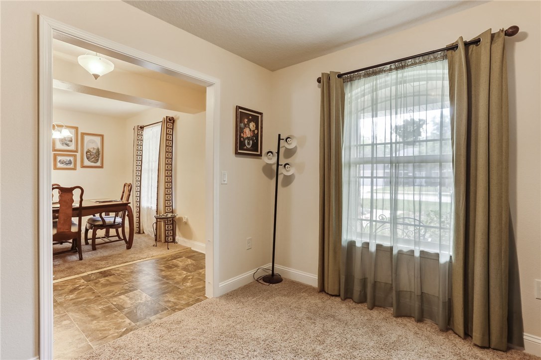 88156 Maybourne Road Yulee, FL 32097 - Photo 7 of 35 a view of a room with furniture and a window