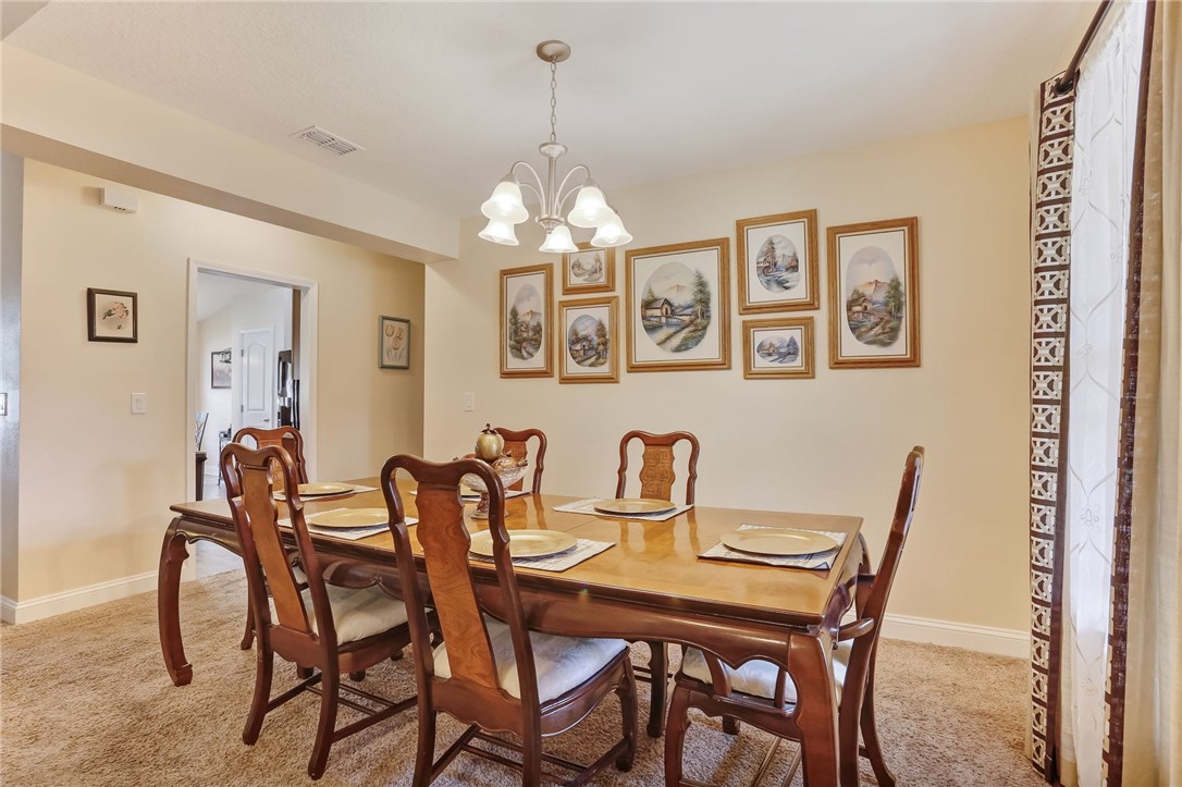 88156 Maybourne Road Yulee, FL 32097 - Photo 8 of 35 a dining room with furniture and window