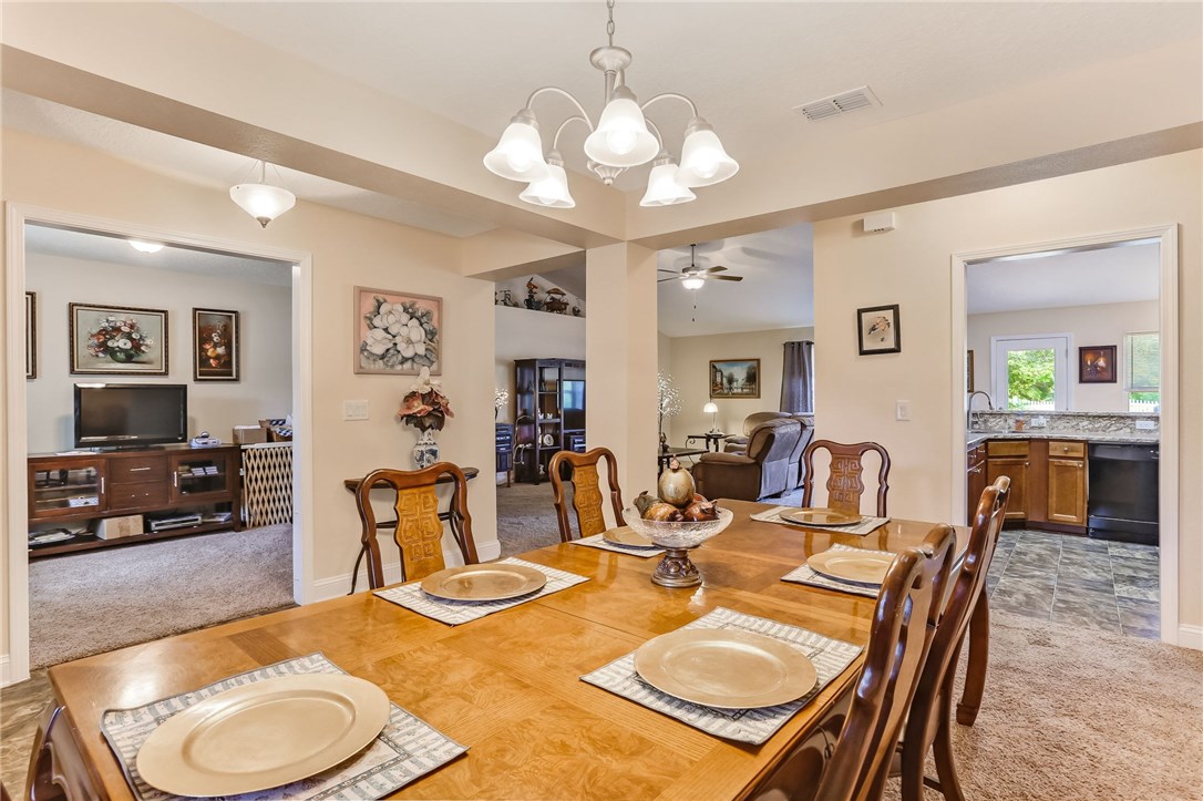 88156 Maybourne Road Yulee, FL 32097 - Photo 9 of 35 a view of a dining room with furniture