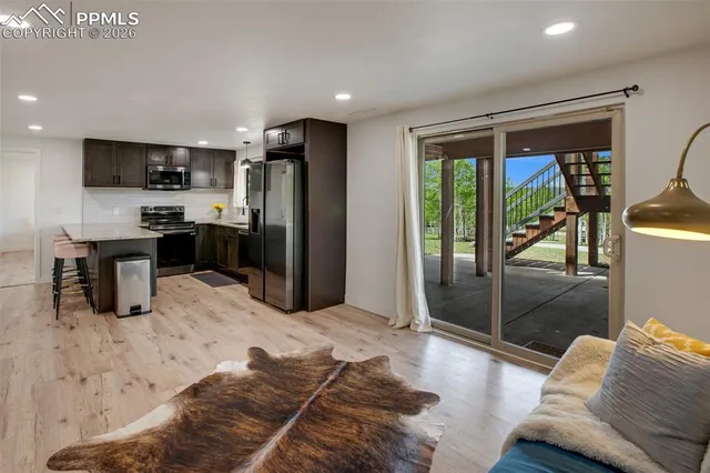 a view of a house with backyard porch and entertaining space