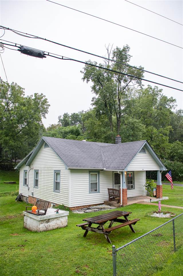 541 Buttermilk Spring Road Staunton, VA 24401 - Photo 5 of 38 a front view of a house with a yard table and chairs